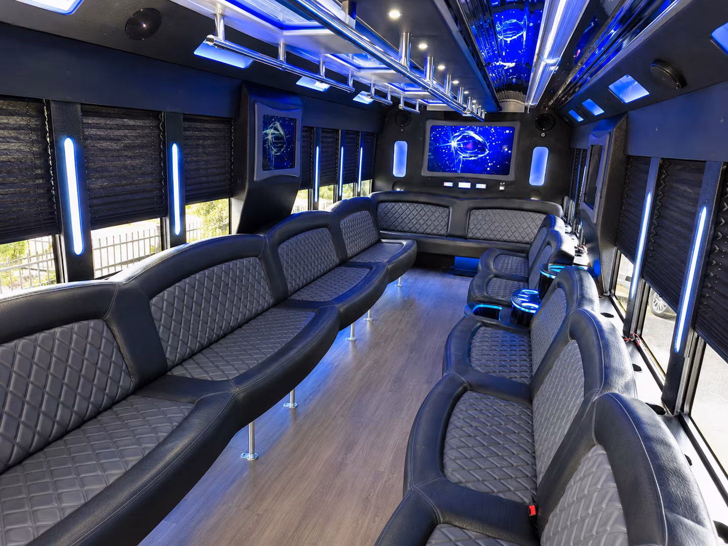 Friends laughing during a party bus celebration in Brownsville